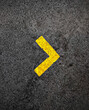 © mistersai - yellow arrow on asphalt