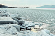 Beautiful shot of the Lake Balaton in Hungary during the winter with mountains on the horizon