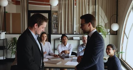 Poster - Friendly smiling boss leader praising male teammate for working success, congratulating with profitable project, promoting or thanking for good job while happy diverse colleagues clapping hands.