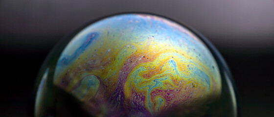 The colorful world of soap bubbles resembling space and honeycomb