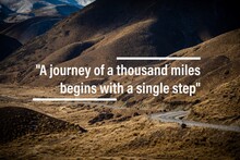 Inspirational Quotes: "A Journey Of A Thousand Miles Begins With A Single Step" Typography With Nature Background