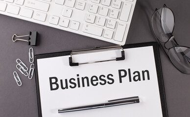 Poster - Office paper sheet with text BUSINESS PLAN and keyboard. Business concept
