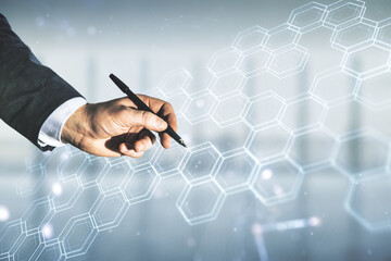Poster - Man hand with pen draws abstract virtual wireless technology hologram with hexagon on blurred office background, artificial intelligence and machine learning concept. Multi exposure