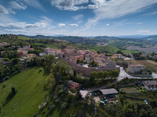  Italy, May 2021: aerial view of the medieval village of Sant'angelo in Lizzola in the province of Pesaro and Urbino in the Marche region. Around the hills of the Marche