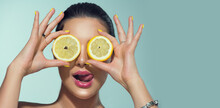 Beautiful Healthy Girl With Slices Of Lemon Citrus Fruit, Food, Cosmetics. Healthy Eating, Diet. Beauty Young Fashion Woman Plays With Lemons, Organic Vegetables. Vegetarian Concept.