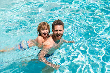 Wall Mural - Dad and son swimming lessons. Pool party. Family summer weekeng. Fathers Day.