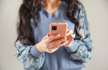 young woman holding smart phone