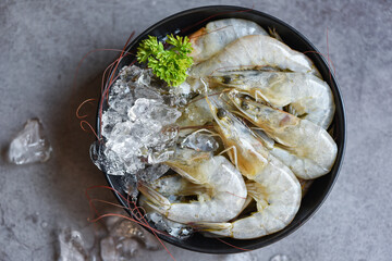 Raw shrimps prawns on ice in bowl, Fresh shrimp seafood with herbs and spice