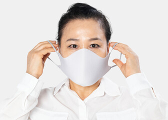 Canvas Print - Senior woman wearing white face mask covid-19 campaign with design space