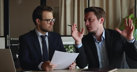 Sticker - Happy two confident businessmen, lawyers or managers in formal wear sitting together at table, discussing paper contract terms of conditions, analyzing partnership agreement at brainstorming meeting.