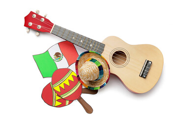 Guitar with Mexican flag, maracas and sombrero hat on white background