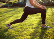 © SuperStock - Close up of young woman stretching before exercise