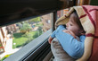 © David Pereiras - Girl looking out the window sad because she can't get out
