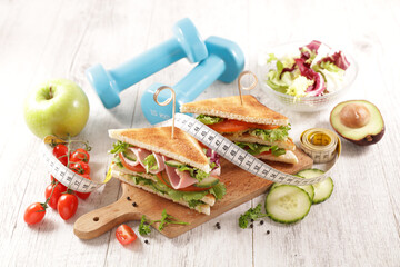 Wall Mural - sandwich with vegetables,  dumbbell and meter