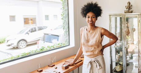 Confident businesswoman in jewelry studio