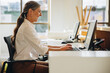 © Jacob Lund - Happy businesswoman working in office