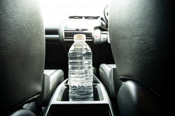 Plastic water bottle left in the vehicle while parking at outdoor carpark