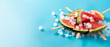 Watermelon slices popsicles and ice on blue background. Copy space