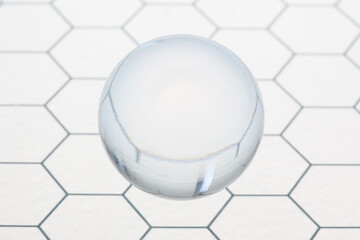 Poster - transparent ball shpere flying on an honeycomb glass pattern with copy space for your text