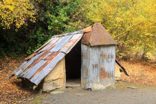 An Old Gold Miner's Hut With A Corrugated Iron Roof And Mud Brick Walls, One Of The Restored Buildings At The Arrowtown Chinese Settlement, New Zealand