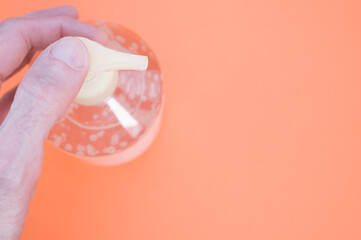 Sticker - Closeup shot of an alcogel hand sanitizer on a colorful background