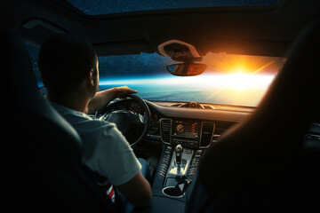 Poster - Man sits in a spaceship car and flies to the planet with a sunset in space. Space travel by car, concept. Driver behind the wheel. Interplanetary taxi in space, creative idea