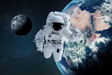Poster - Space man flies in zero gravity in open space with the planet earth and the moon. Space and astronaut wallpaper