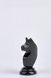 © DenisProduction.com - Black knight chess piece isolated on white background.