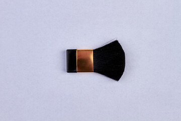 Wall Mural - Small makeup brush isolated on white background.