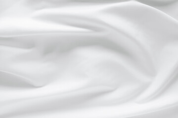 Abstract white fabric texture background. Cloth soft wave. Creases of satin, silk, and cotton.