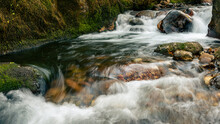 River Stream Detail Shot With Motion Blur In The Water