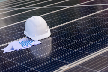 Solar panels of a solar power station at a photovoltaic power station Engineers working on the inspection and maintenance of solar energy equipment in the industry. Power chart section