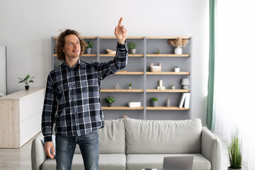 Poster - Man Pointing Finger Up Pushing Button On Invisible Screen Indoors