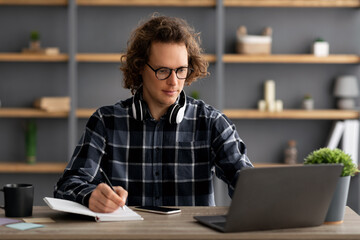 Poster - Young Entrepreneur Working Taking Notes Writing Business Report At Workplace