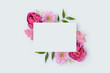 © rorygezfresh - Floral frame made of alstroemeria and rose flower on a blue background. Paper card mockup. Festive concept for Mothers Day.