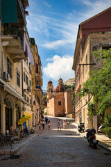 Narrow street with a church in Corfu Town, Greece