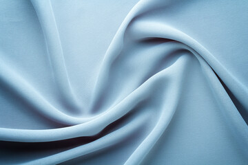 Wall Mural - light blue fabric draped with swirl folds, textile background