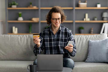 Poster - Guy Using Credit Card And Smartphone Shopping Online At Home