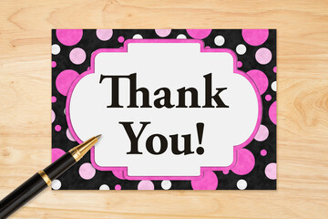 Wall Mural - Thank You message on a greeting card on wood desk