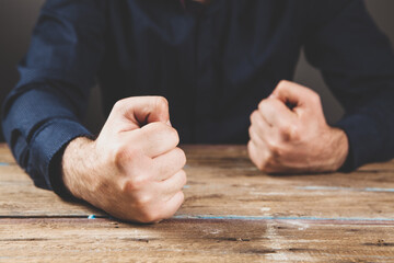 Wall Mural - hits the table with his fist