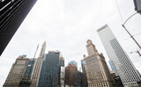 Fototapeta Miasto - CHICAGO, ILLINOIS - APRIL 18, 2021: Looking up at tall office buildings and skyscrapers in Chicago.