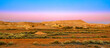Night banner panorama of Coober Pedy opal mining town in Australia at twilight. Opal capital town of the world in South Australia. Breakaways Reserve