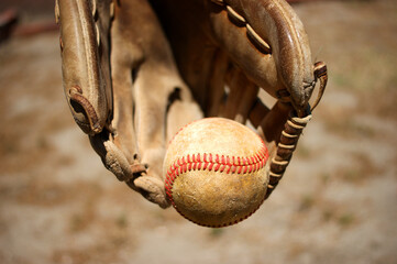 Wall Mural - Person catching baseball with leather glove