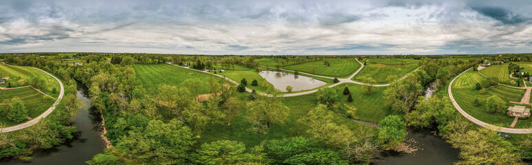 Aerial panorama of horse farms and fields close to the city of Midway, Kentucky