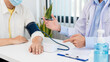 © Pichsakul - Medical concept a male doctor measuring blood pressure of patient by using sphygmomanometer before examination