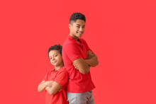 Portrait Of African-American Brothers On Color Background