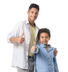 Wall Mural - African-American boys showing thumb-up on white background