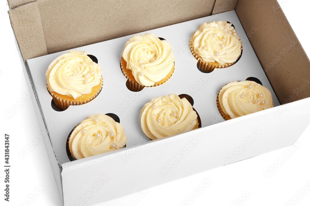 Box with tasty cupcakes on white background, closeup