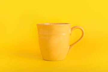 Stylish cup on color background