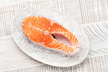 Sticker - Fresh raw salmon cooking. Fish steak on ice